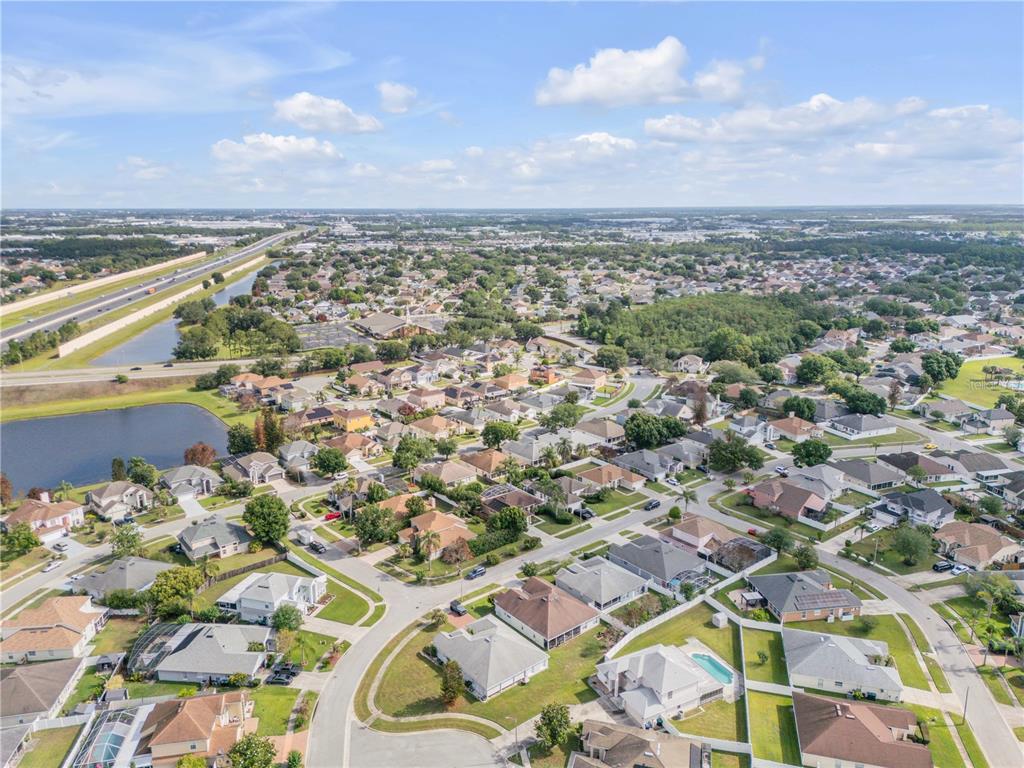 12232 Bronson Way Orlando, FL 32824 - Photo 26 of 32 an aerial view of residential building with yard