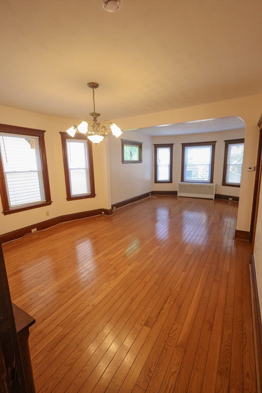 17 Maple Avenue, Unit 1 Everett, MA 02149 - Photo 4 of 8 a view of livingroom with hardwood floor and window