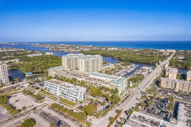 an aerial view of residential building and ocean view