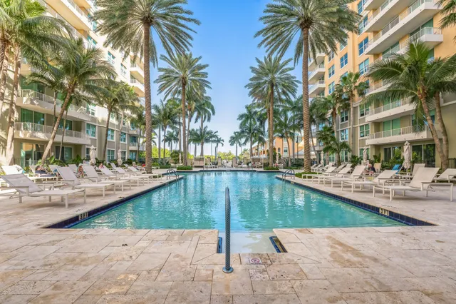 a swimming pool with outdoor seating and yard
