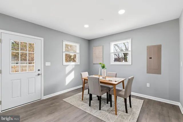 a view of a dining room with furniture and a window