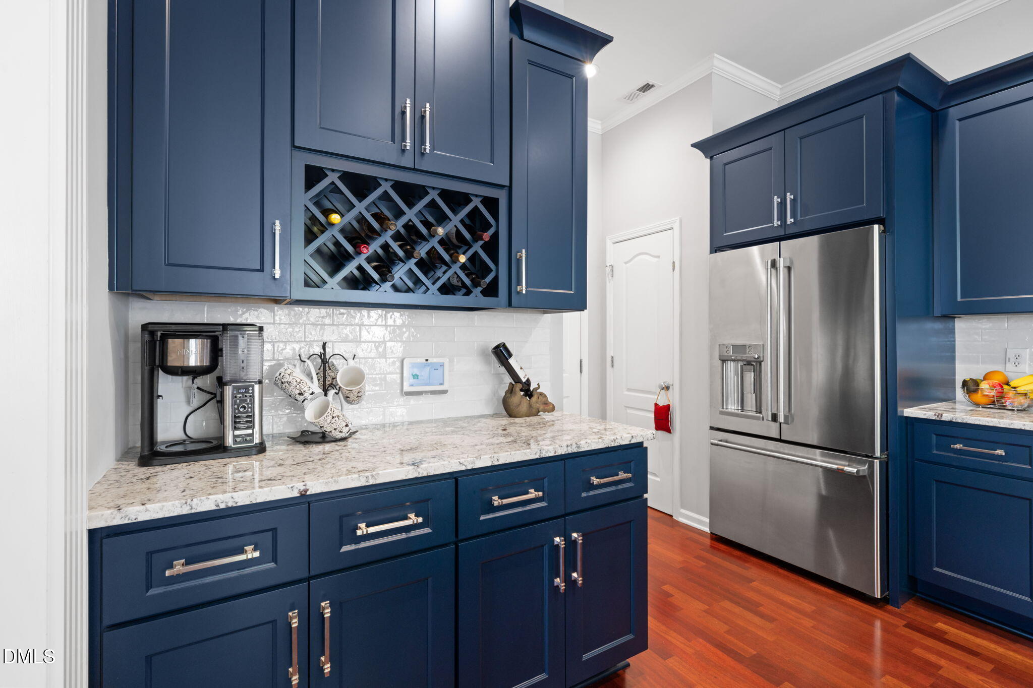 13227 Ashford Park Drive Raleigh, NC 27613 - Photo 14 of 55 a kitchen with granite countertop stainless steel appliances a refrigerator and a sink