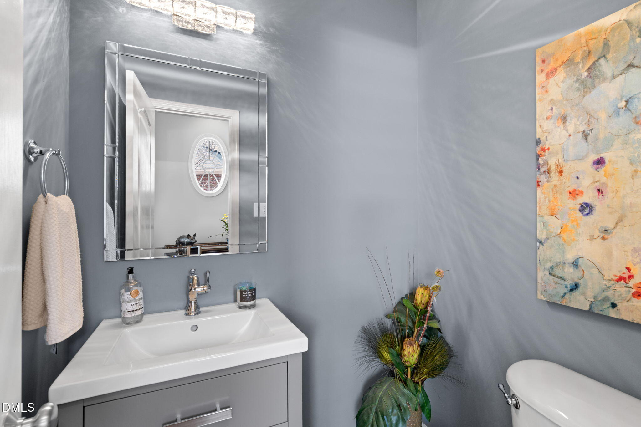 13227 Ashford Park Drive Raleigh, NC 27613 - Photo 20 of 55 a bathroom with a sink mirror and toilet