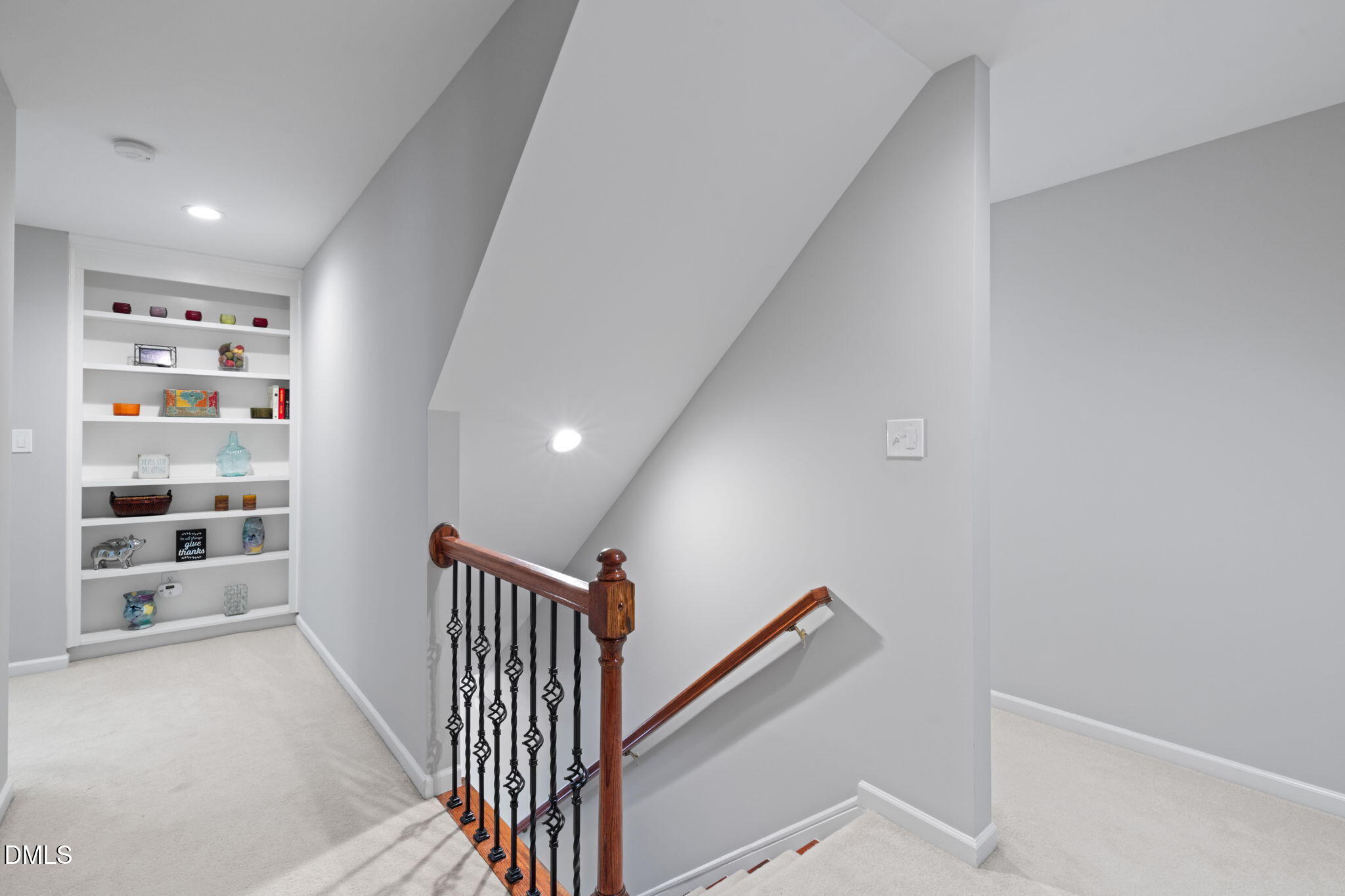 13227 Ashford Park Drive Raleigh, NC 27613 - Photo 22 of 55 a view of hallway with stairs and wooden floor
