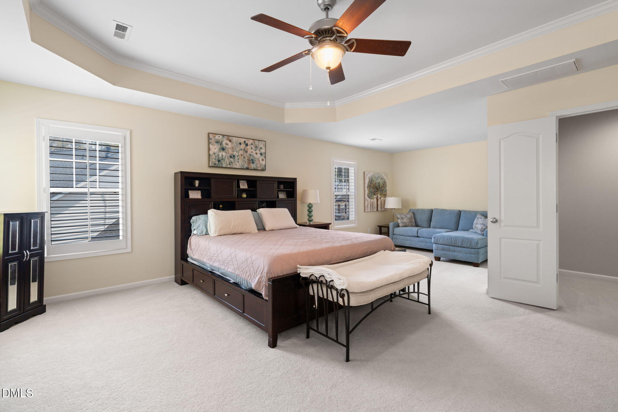 13227 Ashford Park Drive Raleigh, NC 27613 - Photo 25 of 55 a spacious bedroom with a bed couch and a window