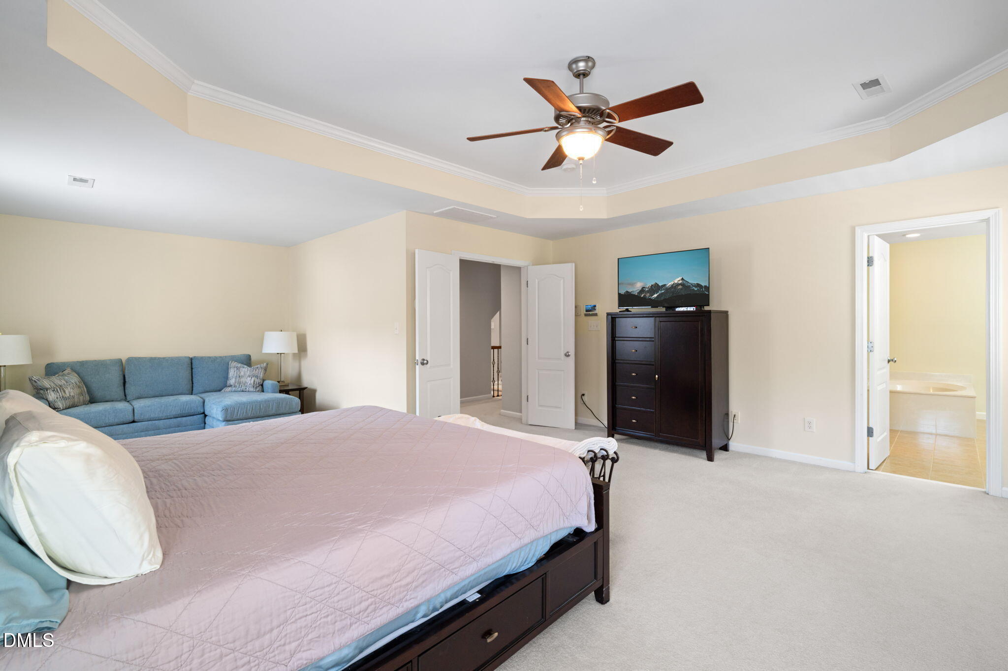 13227 Ashford Park Drive Raleigh, NC 27613 - Photo 26 of 55 a bed room with a bed and a ceiling fan