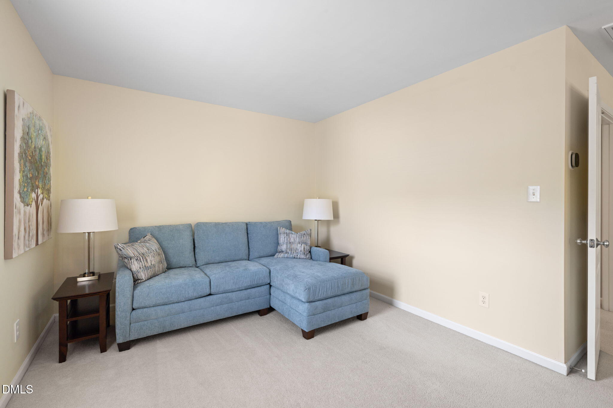 13227 Ashford Park Drive Raleigh, NC 27613 - Photo 27 of 55 a living room with furniture and a lamp