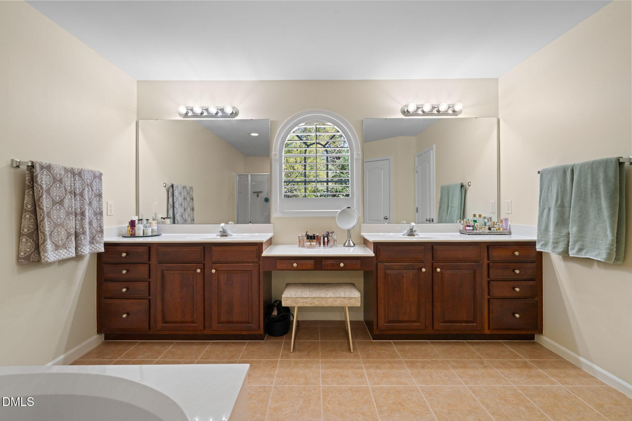 13227 Ashford Park Drive Raleigh, NC 27613 - Photo 28 of 55 a spacious bathroom with a tub sink and mirror