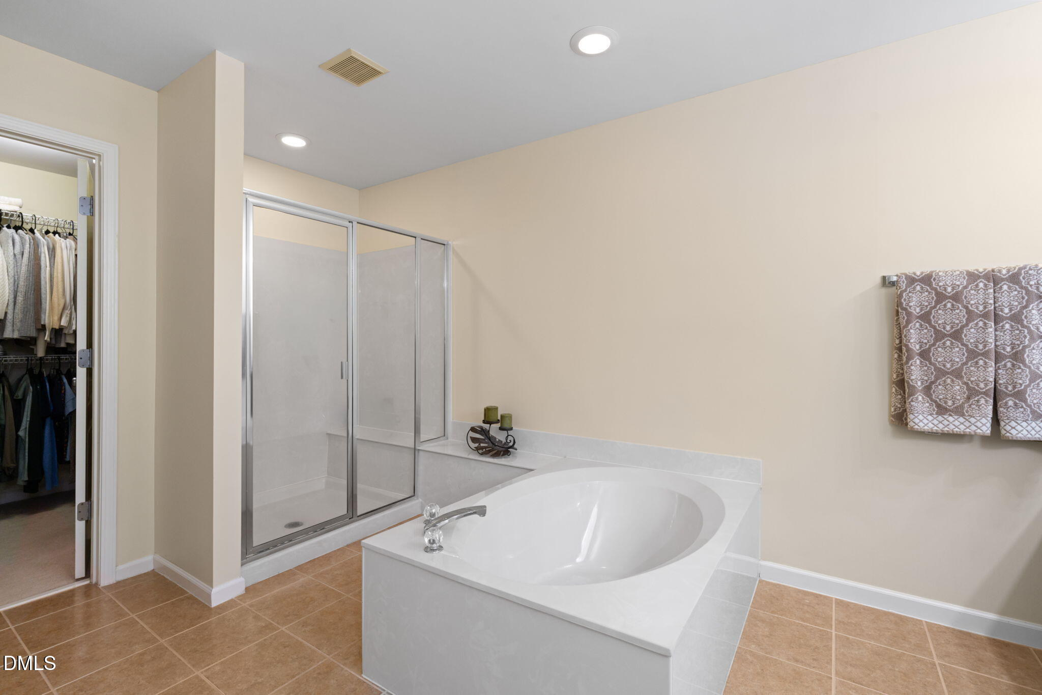 13227 Ashford Park Drive Raleigh, NC 27613 - Photo 29 of 55 a bathroom with a bathtub and shower