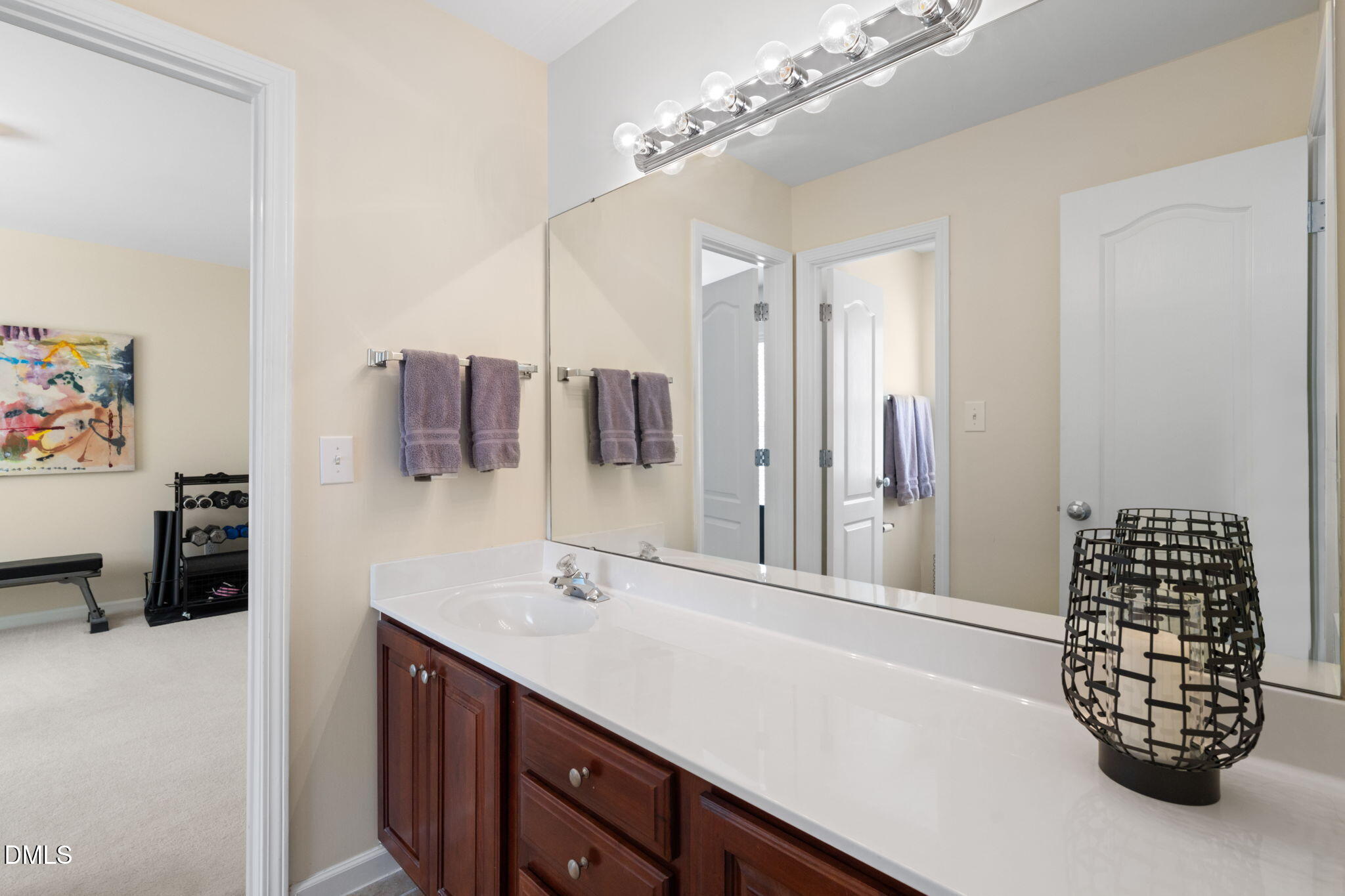 13227 Ashford Park Drive Raleigh, NC 27613 - Photo 33 of 55 a bathroom with a double vanity sink and a mirror