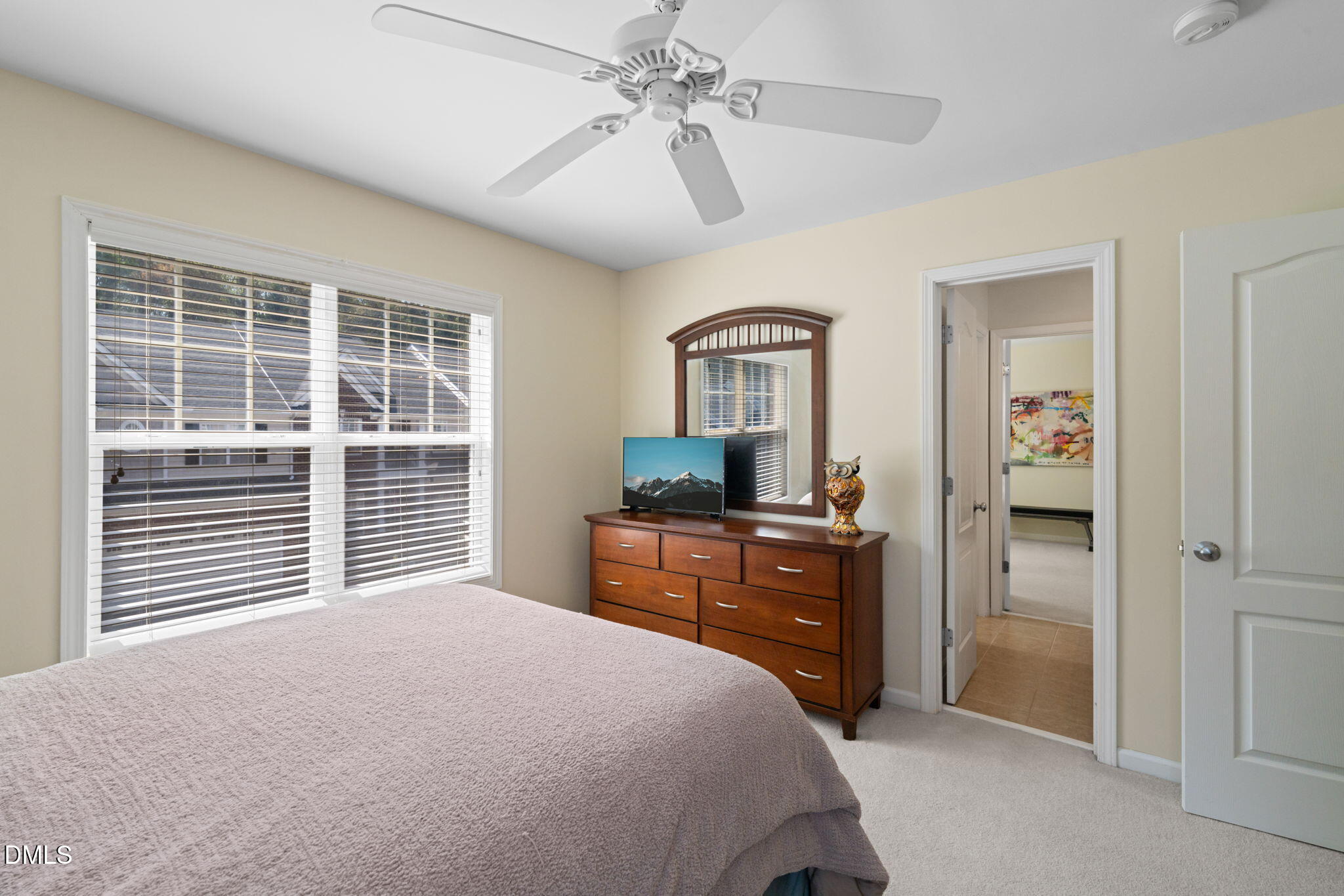 13227 Ashford Park Drive Raleigh, NC 27613 - Photo 34 of 55 a bedroom with a bed and a dresser
