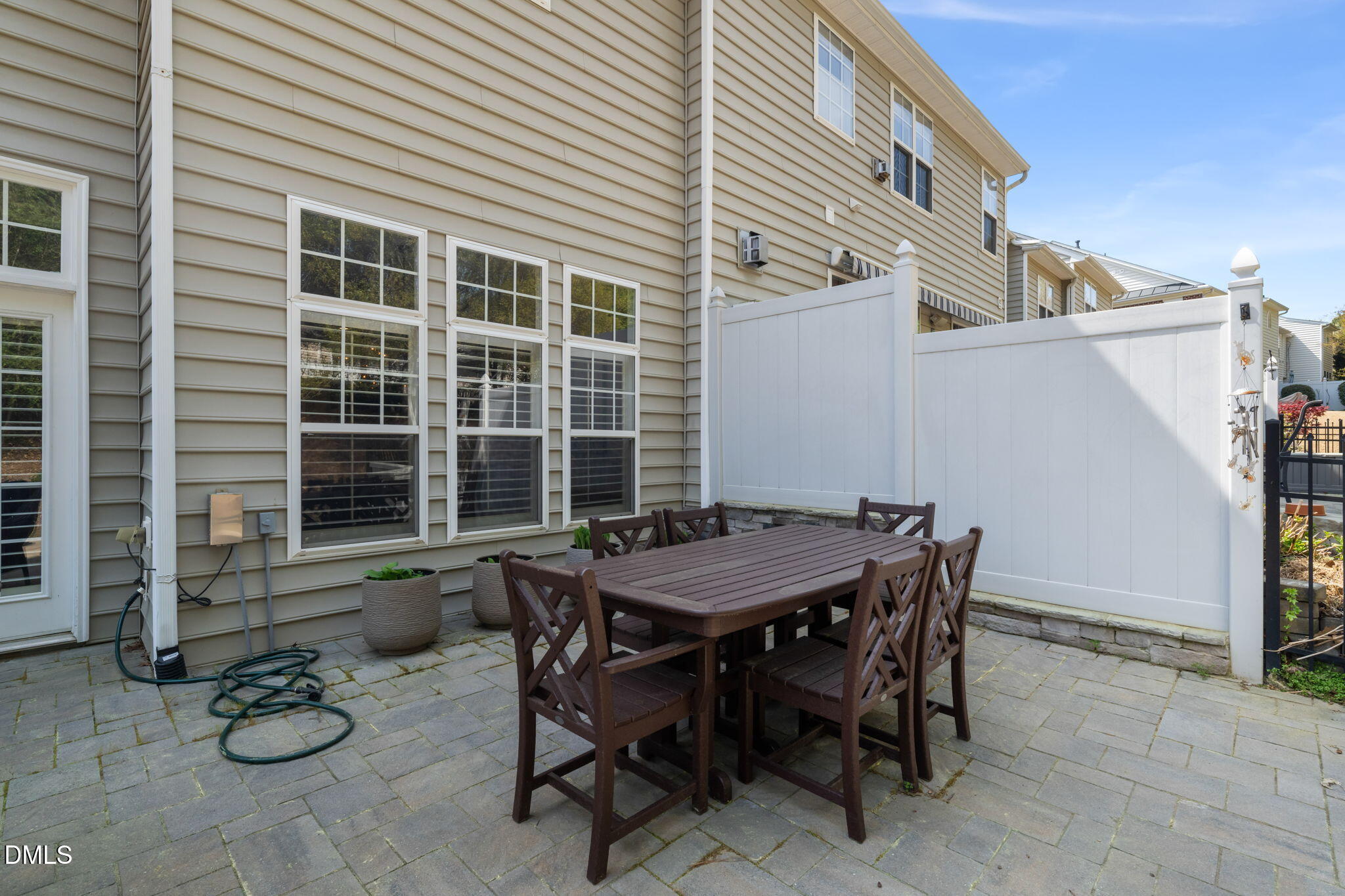 13227 Ashford Park Drive Raleigh, NC 27613 - Photo 40 of 55 a backyard of a house with table and chairs