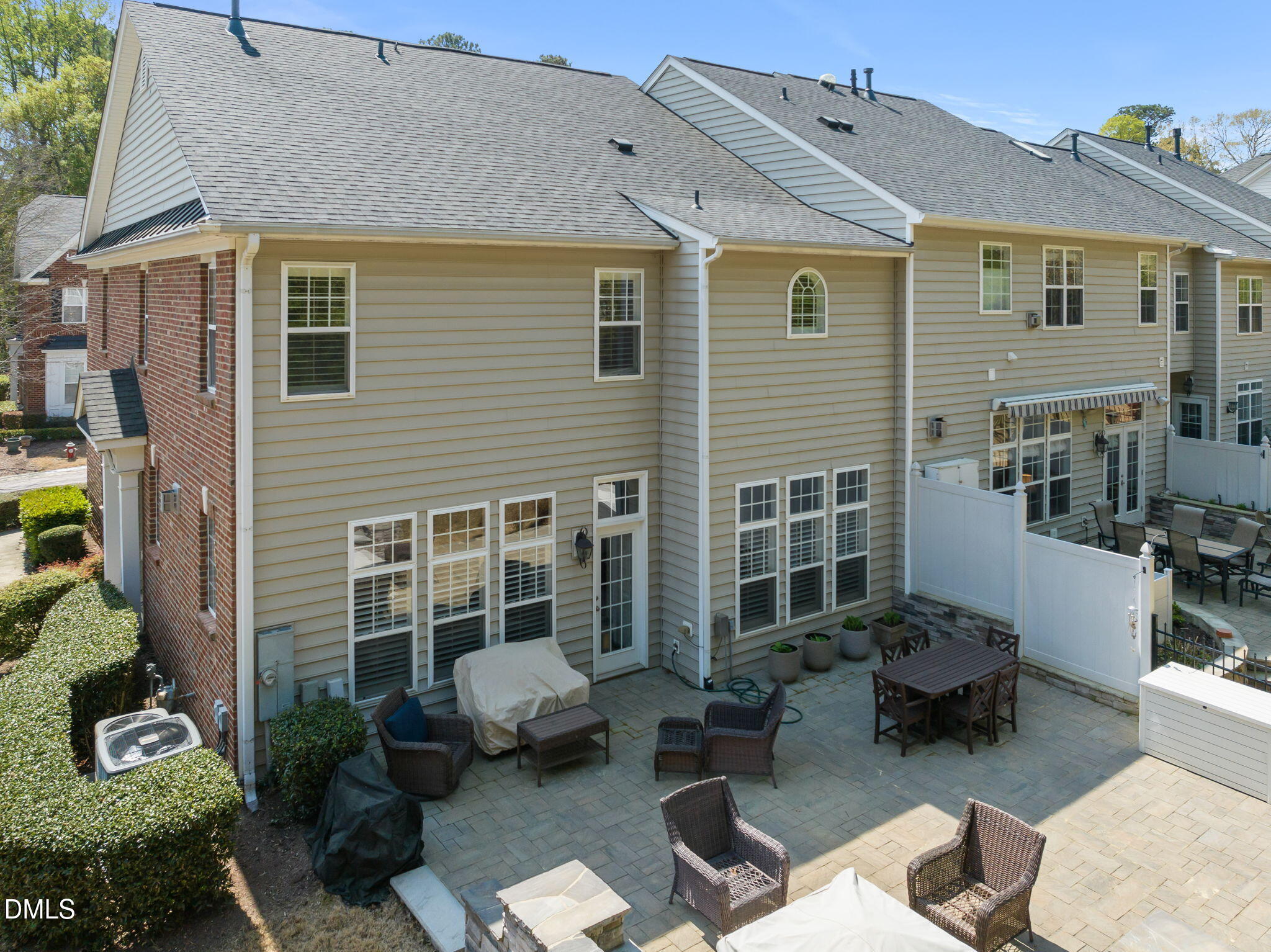 13227 Ashford Park Drive Raleigh, NC 27613 - Photo 48 of 55 a view of a patio with couches table and chairs and potted plants
