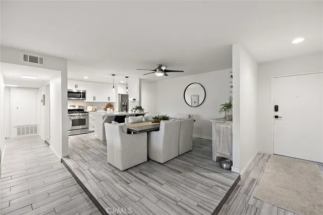 a view of a kitchen with electric appliances