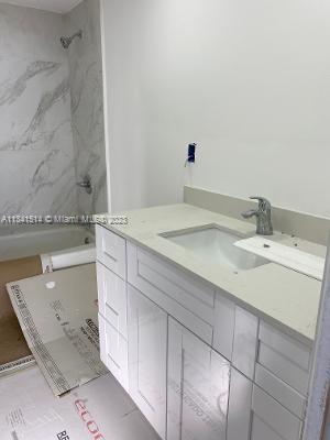 Ojus Miami, FL 33179 - Photo 14 of 18 a bathroom with a sink and a mirror