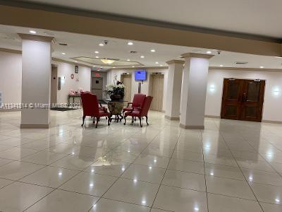 Ojus Miami, FL 33179 - Photo 7 of 18 a lobby with furniture and a potted plant