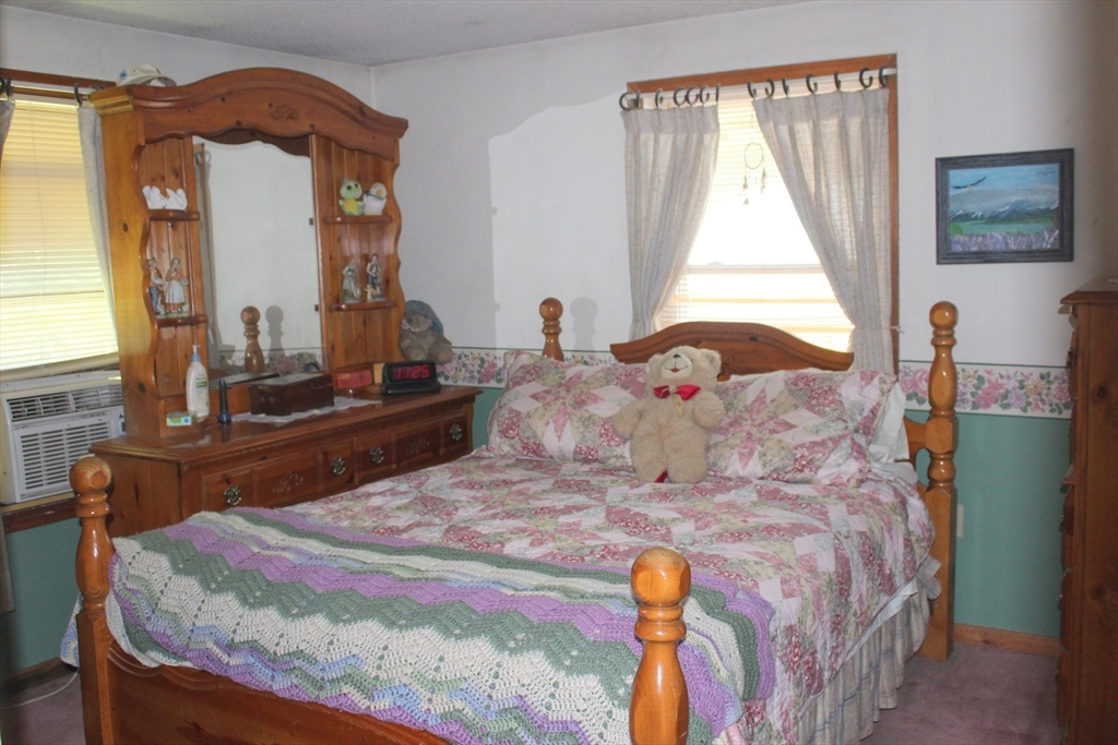 999 Jones Hill Road Ashby, MA 01431 - Photo 8 of 20 a bedroom with a bed and a window