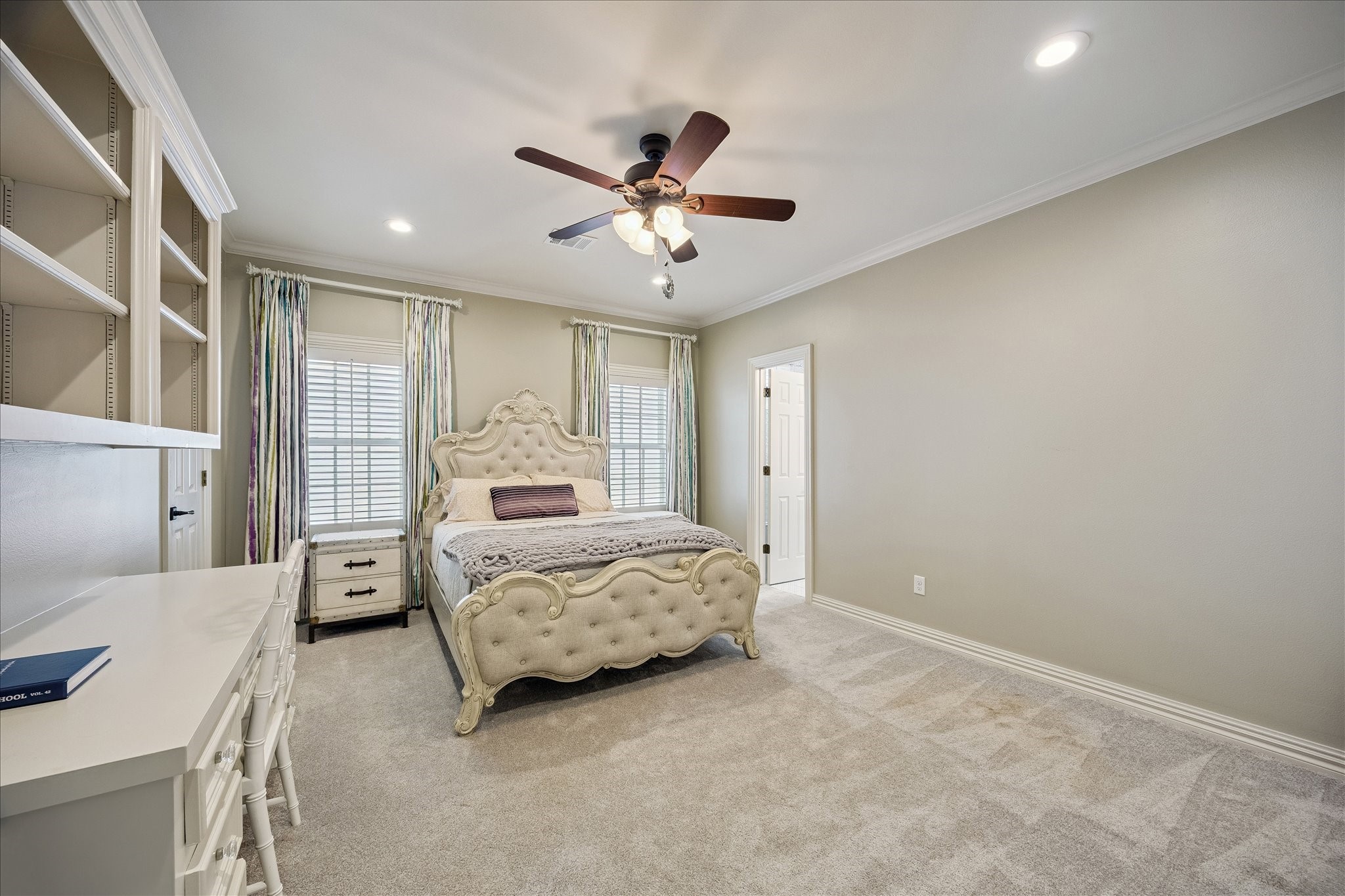 6358 Auden Street Houston, TX 77005 - Photo 26 of 50 a bedroom with a bed and window