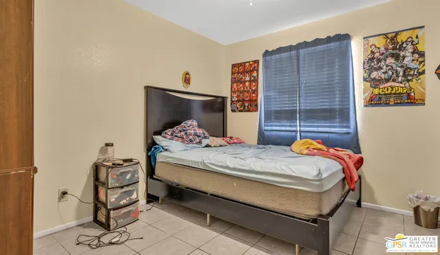 a bedroom with a bed and a cabinets