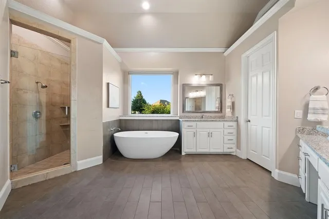 a room with a couch and a view of bathroom