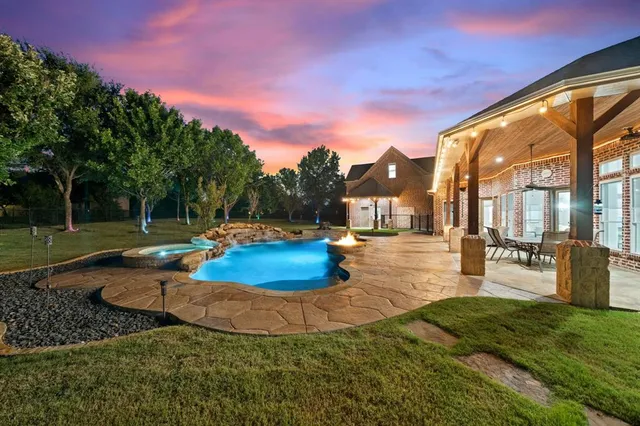 a view of a swimming pool with a patio