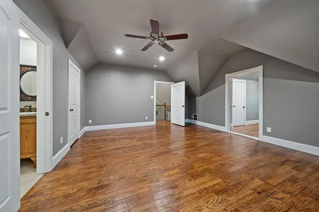 a view of an empty room and wooden floor