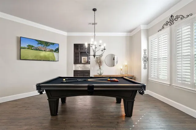 a room with table chair and window