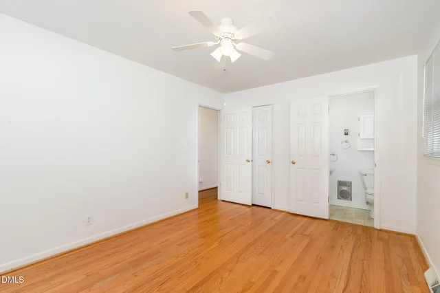 a living room with a couch and a chandelier