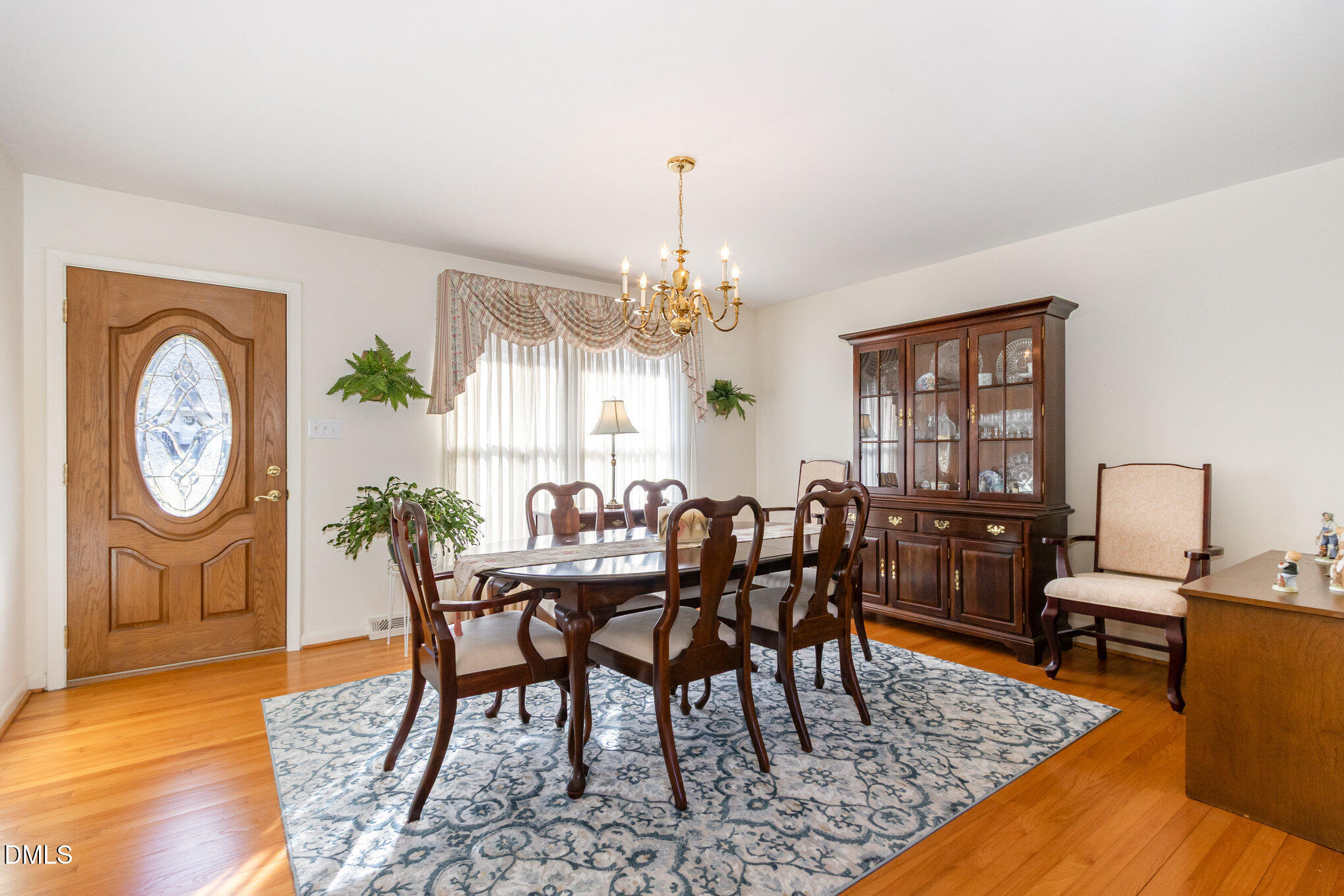 310 Mickey Circle Durham, NC 27712 - Photo 3 of 27 a view of a dining room with furniture window and wooden floor
