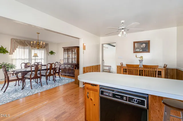 a view of a dining room with furniture and window