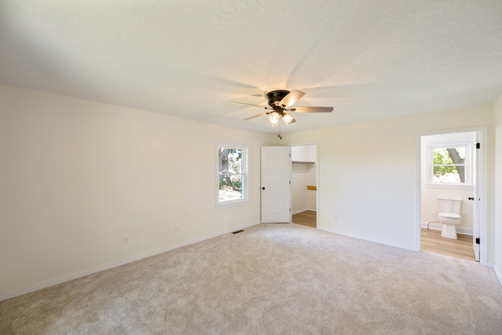 6920 Highway 192 Holladay, TN 38341 - Photo 27 of 38 a view of a livingroom with a chandelier fan and a window