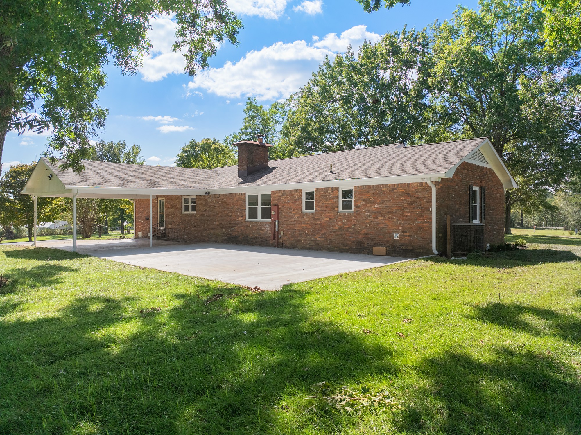 6920 Highway 192 Holladay, TN 38341 - Photo 3 of 38 a front view of a house with a yard and garage