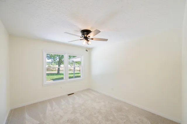 an empty room that has a window