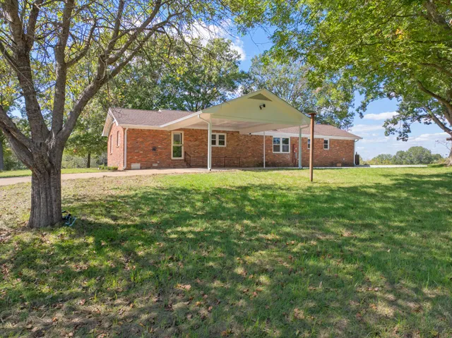 a house with a tree in front of it