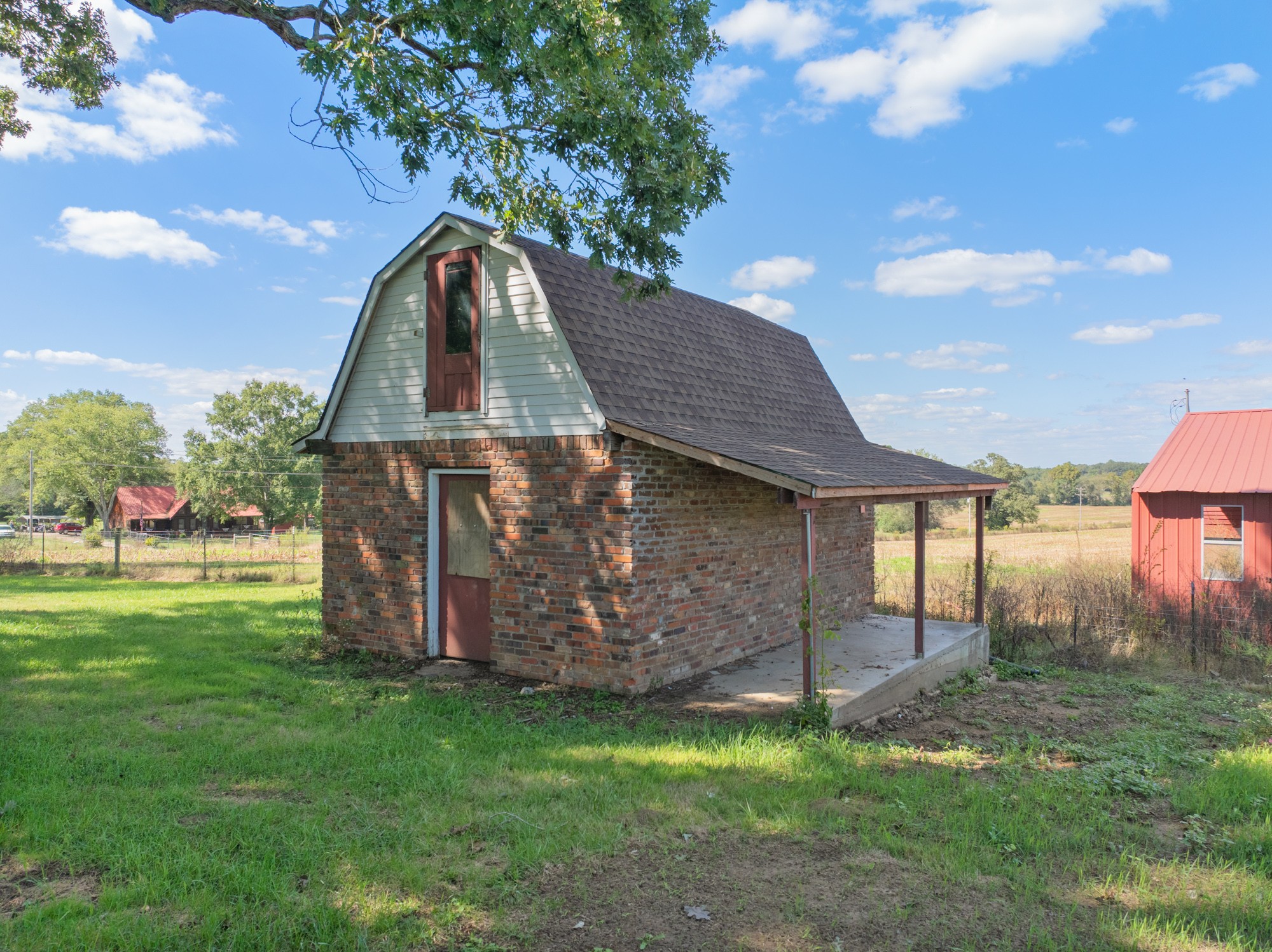 6920 Highway 192 Holladay, TN 38341 - Photo 8 of 38 a backyard of a house with lots of green space and outdoor seating