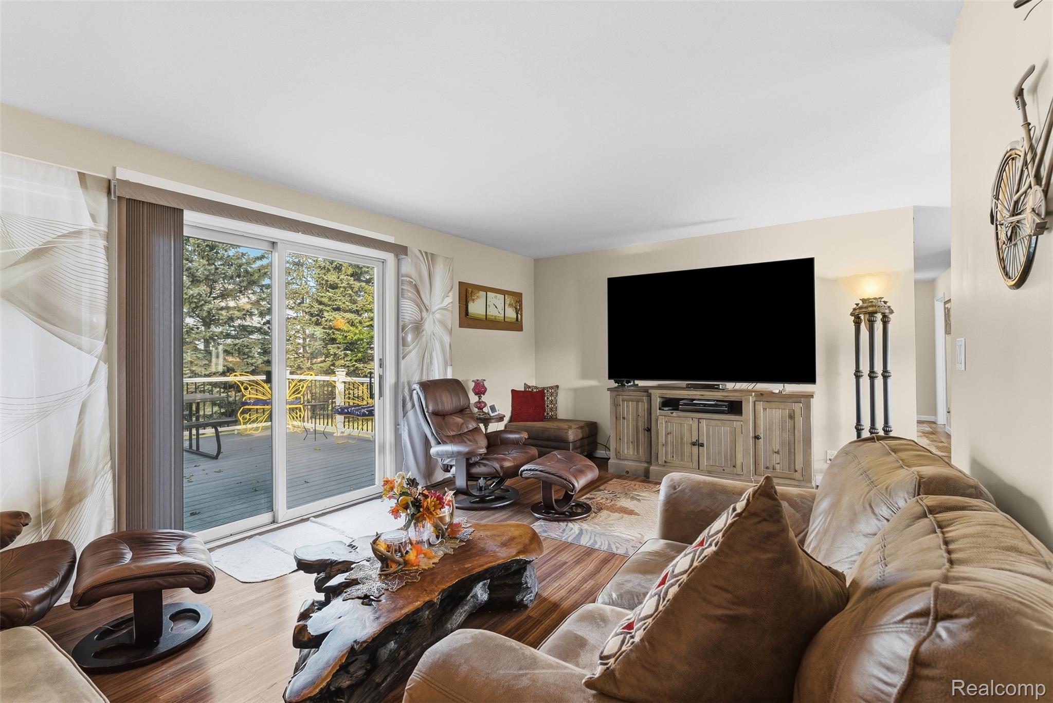 2227 North Graf Road Caro, MI 48723 - Photo 19 of 51 Wood-finish flooring throughout, light-toned walls, and a sliding glass door leading to an outdoor deck