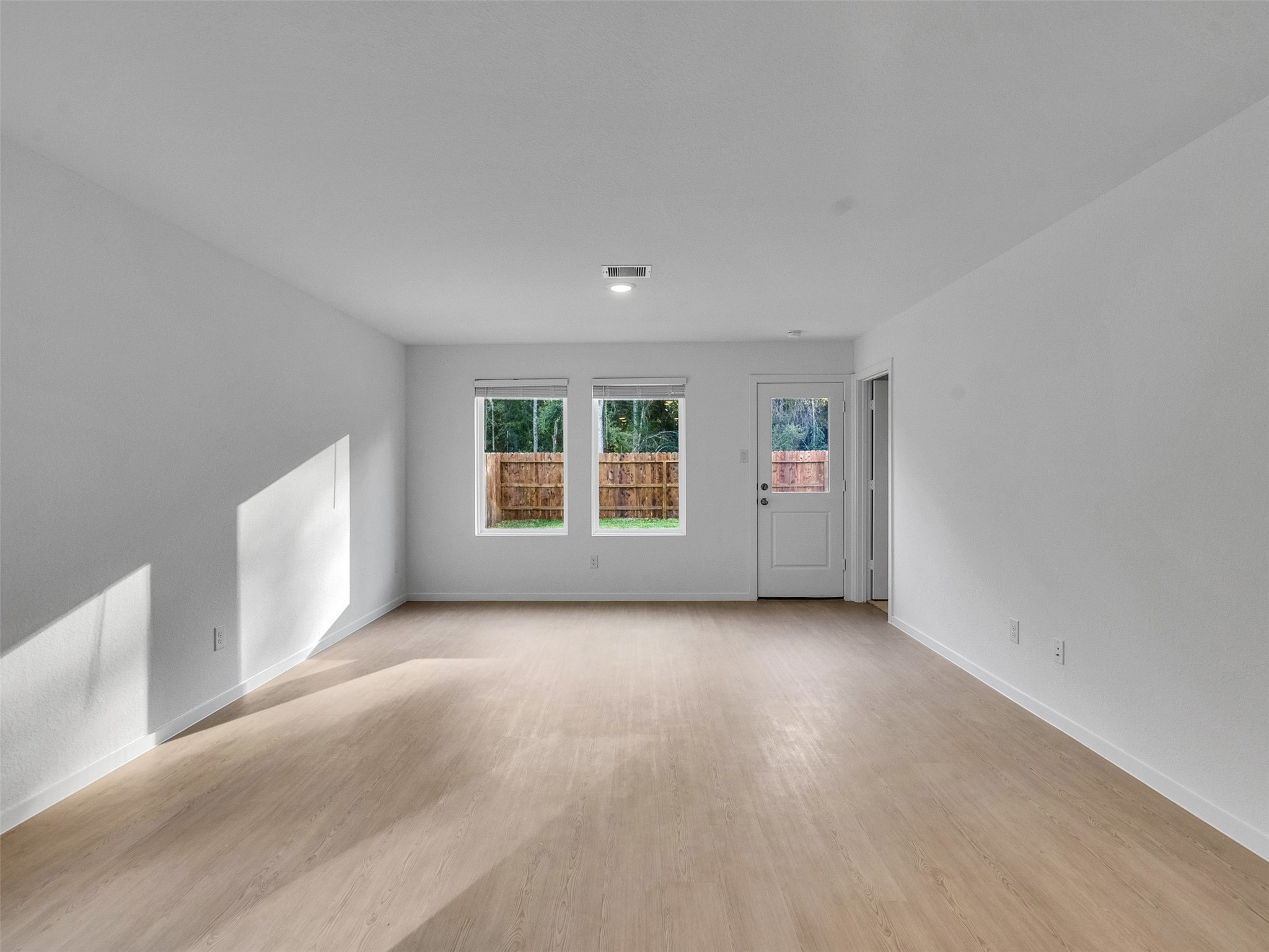 17974 Valle Cupa Lane New Caney, TX 77357 - Photo 11 of 36 an empty room with windows
