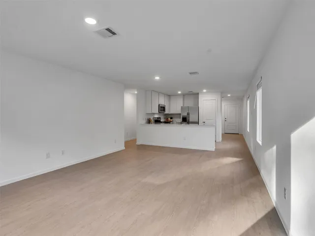 a view of a kitchen with a sink and a microwave