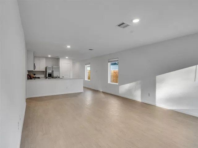 a view of a kitchen with a sink and cabinets