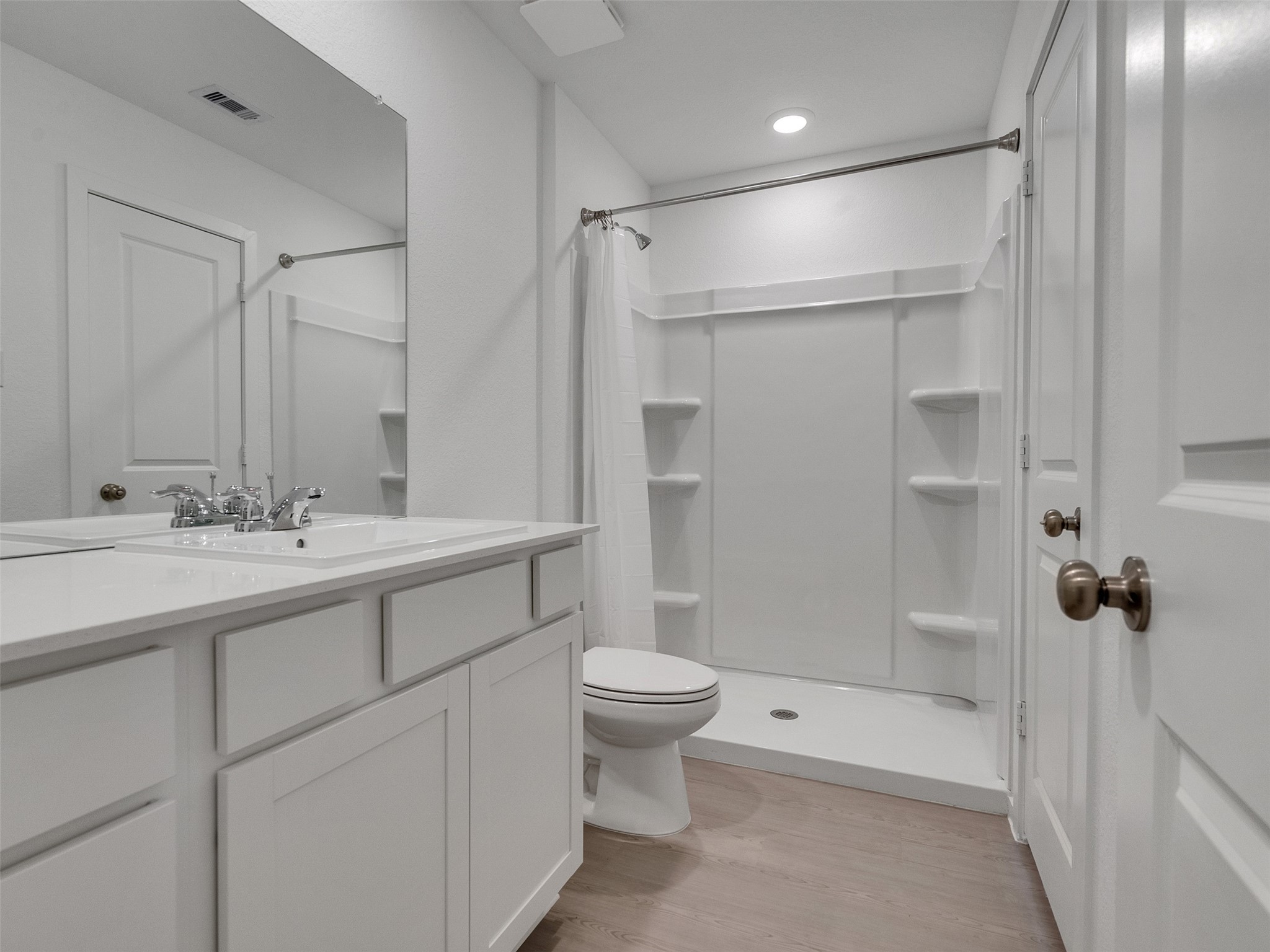 17974 Valle Cupa Lane New Caney, TX 77357 - Photo 16 of 36 a bathroom with a sink toilet and shower