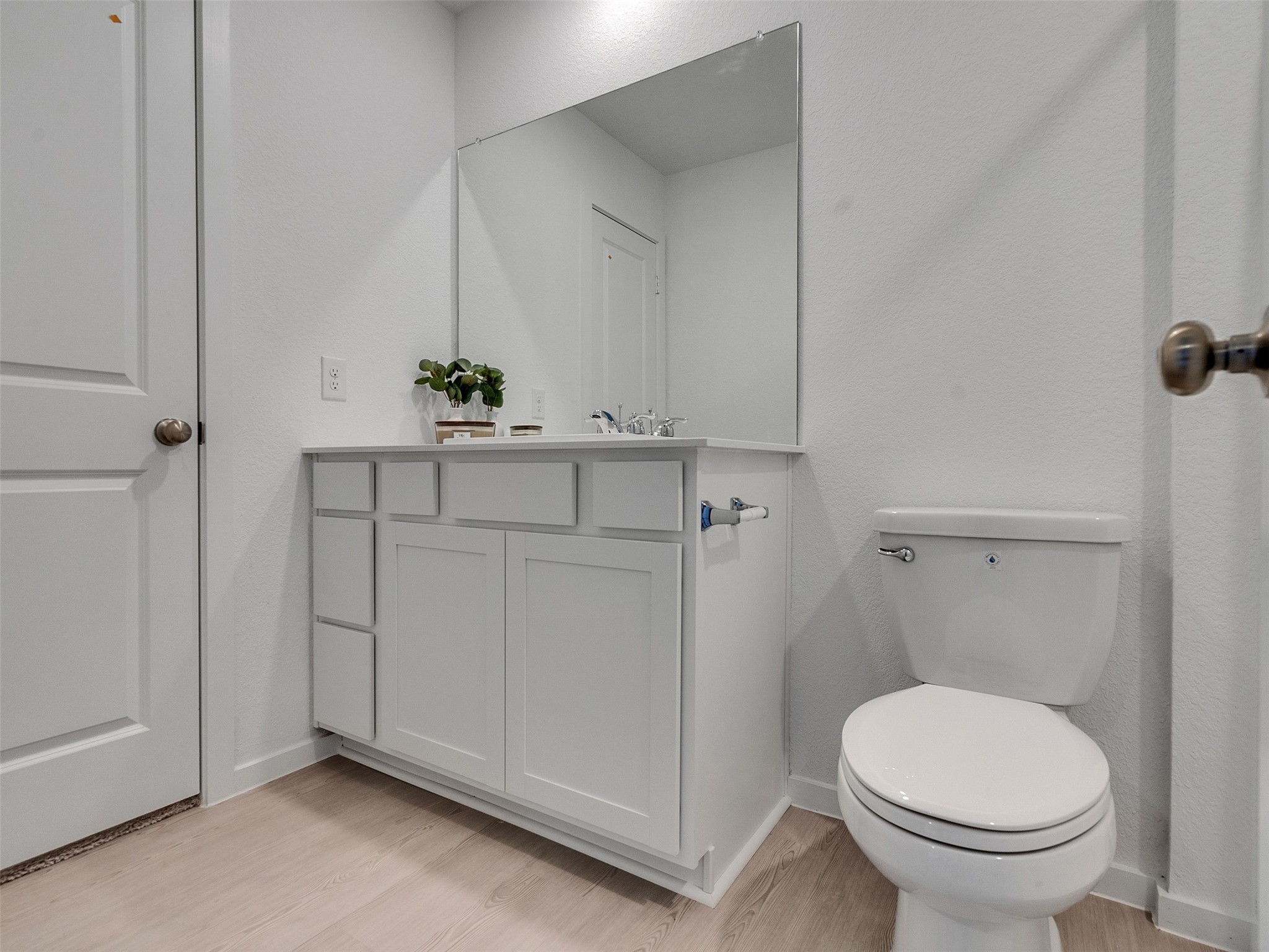 17974 Valle Cupa Lane New Caney, TX 77357 - Photo 17 of 36 a bathroom with a sink a toilet and a mirror