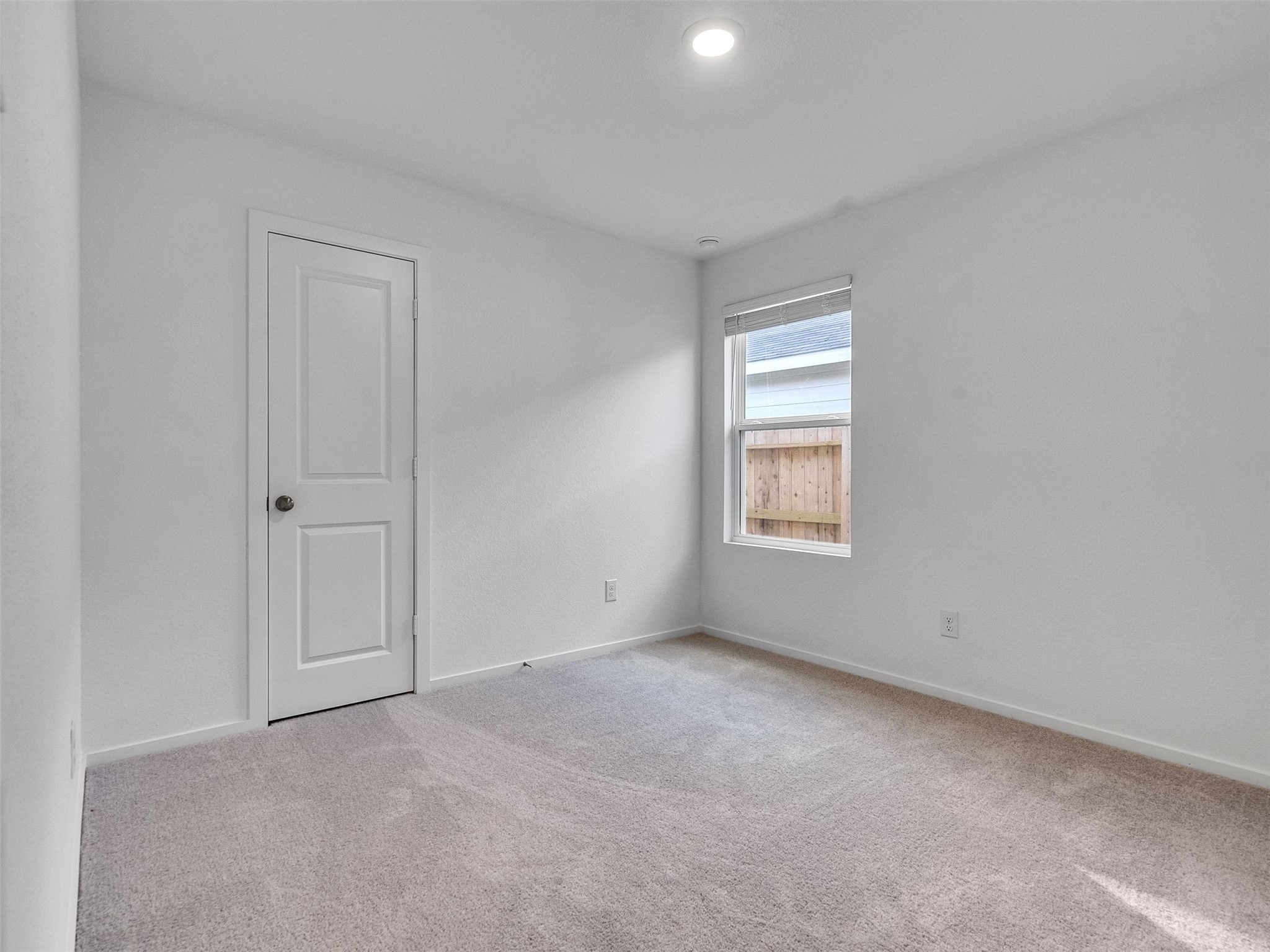 17974 Valle Cupa Lane New Caney, TX 77357 - Photo 19 of 36 a view of an empty room with a window