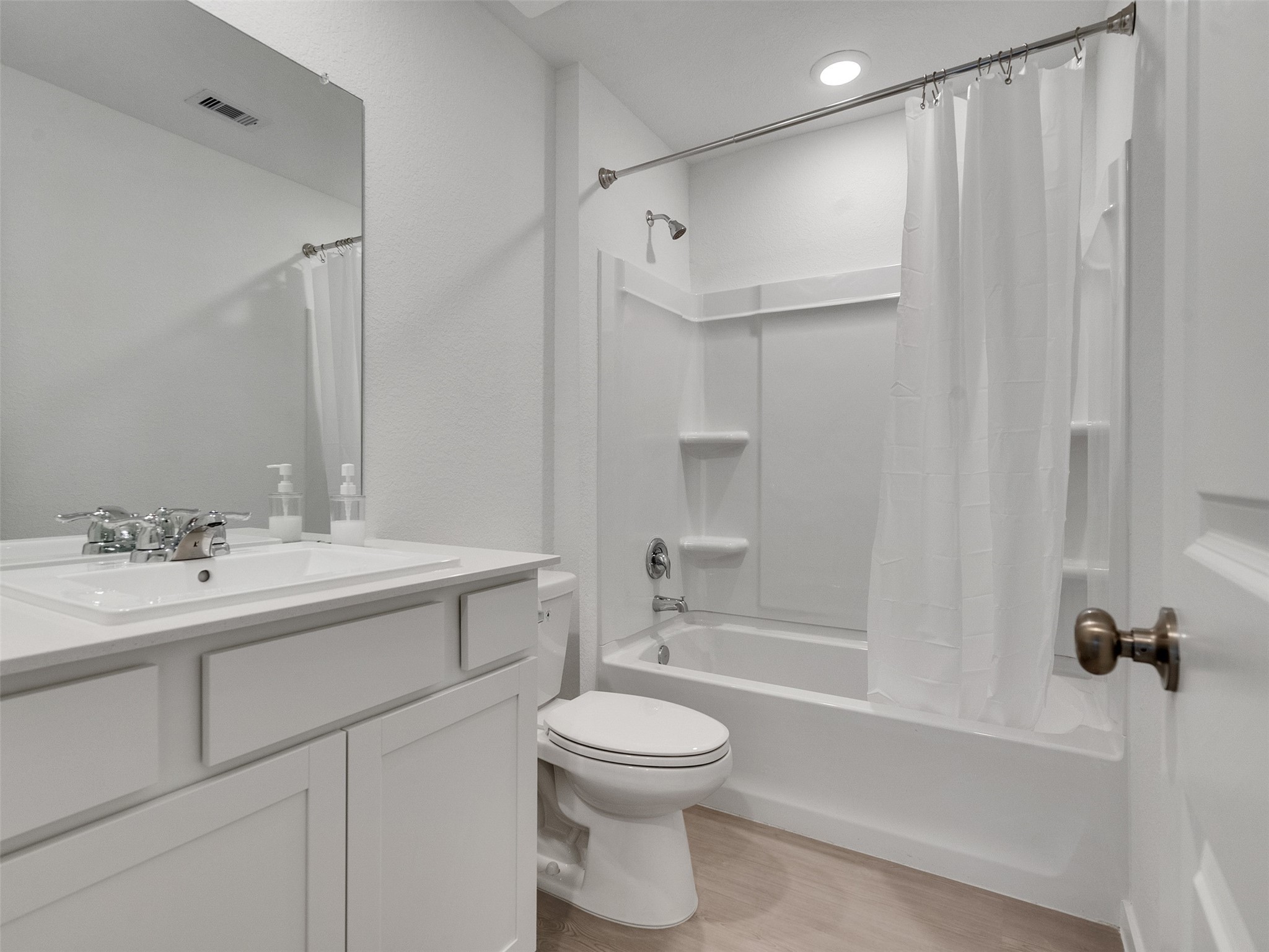 17974 Valle Cupa Lane New Caney, TX 77357 - Photo 21 of 36 a bathroom with a toilet a sink and a bathtub