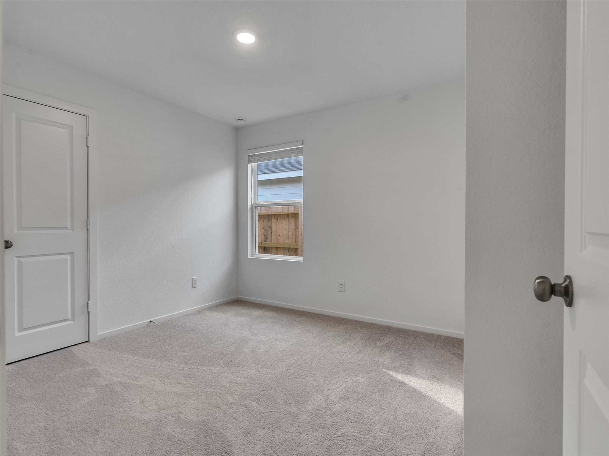 17974 Valle Cupa Lane New Caney, TX 77357 - Photo 24 of 36 a view of an empty room with a window