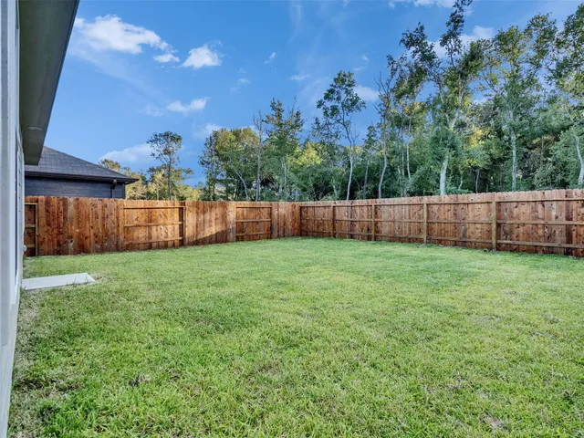 a view of yard with patio