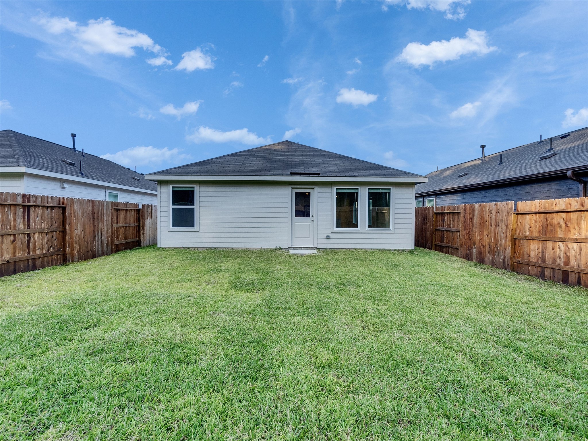 17974 Valle Cupa Lane New Caney, TX 77357 - Photo 28 of 36 a front view of a house with a garden