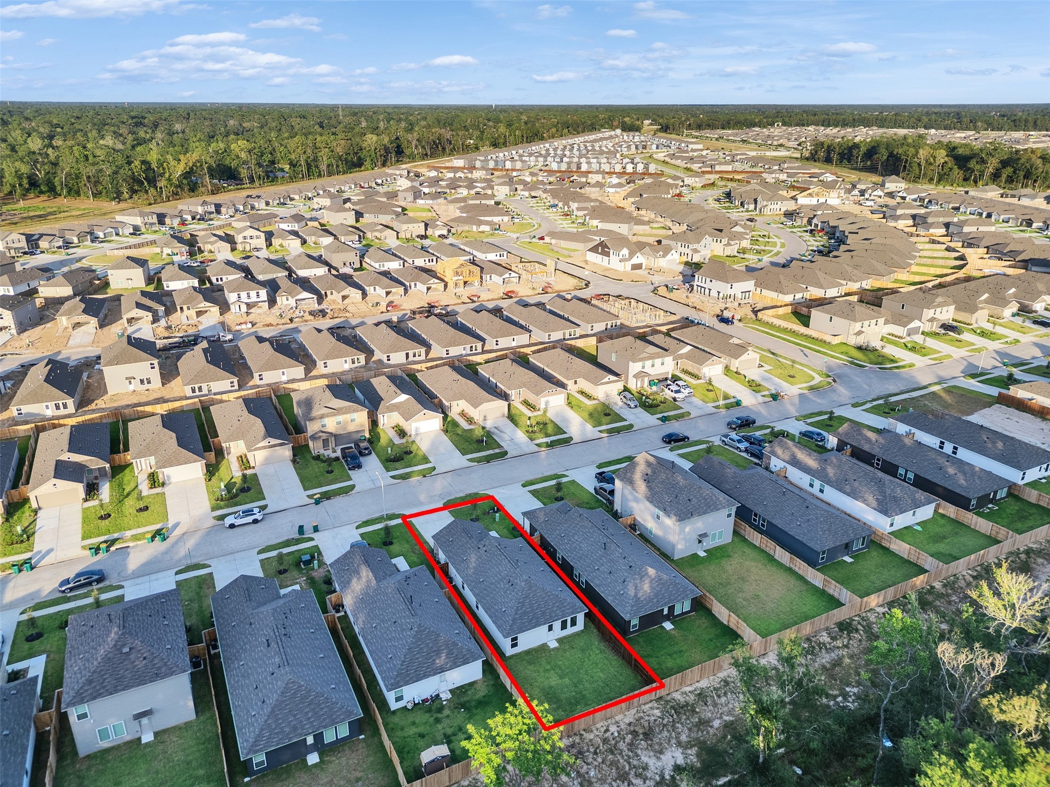 17974 Valle Cupa Lane New Caney, TX 77357 - Photo 32 of 36 an aerial view of residential houses with outdoor space