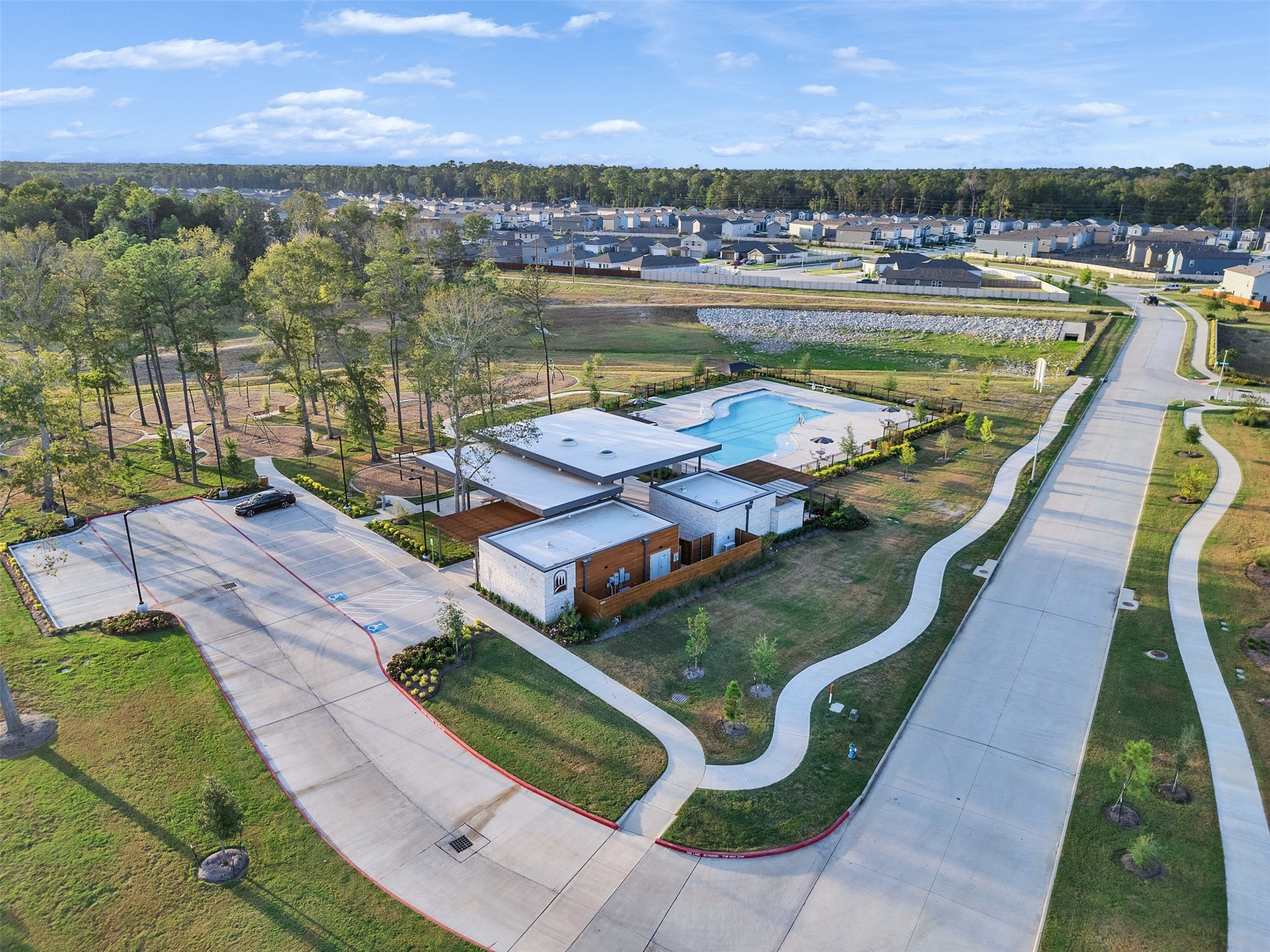 17974 Valle Cupa Lane New Caney, TX 77357 - Photo 36 of 36 a view of swimming pool with outdoor seating and lake view