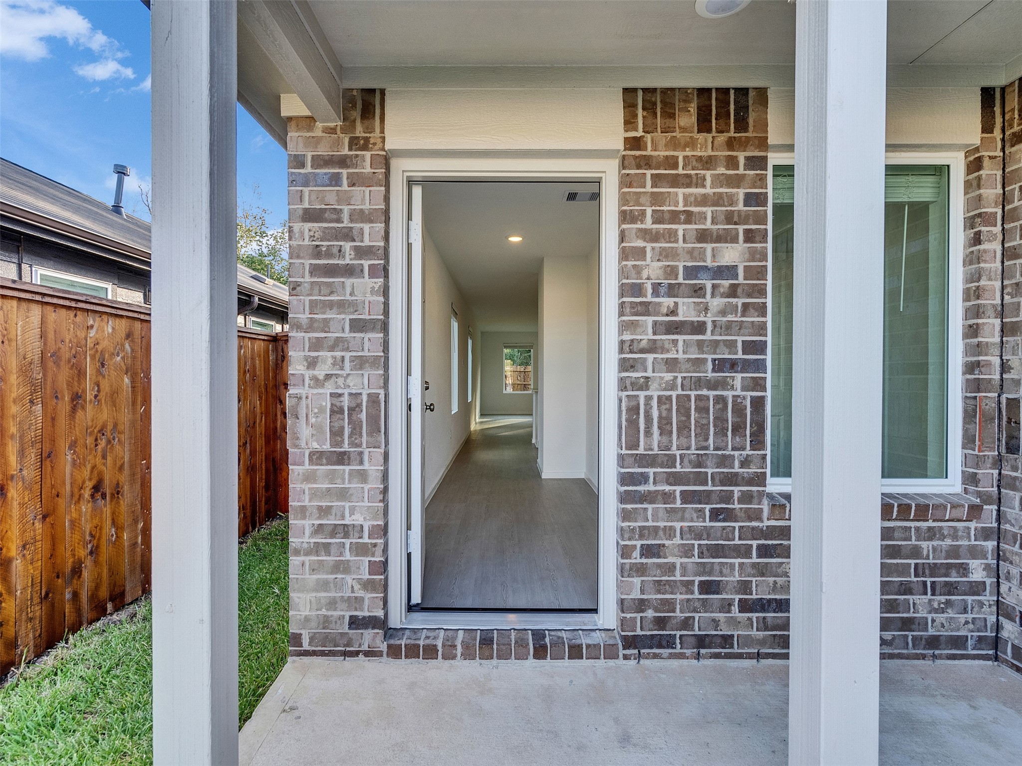 17974 Valle Cupa Lane New Caney, TX 77357 - Photo 5 of 36 front view of a brick house with a large door