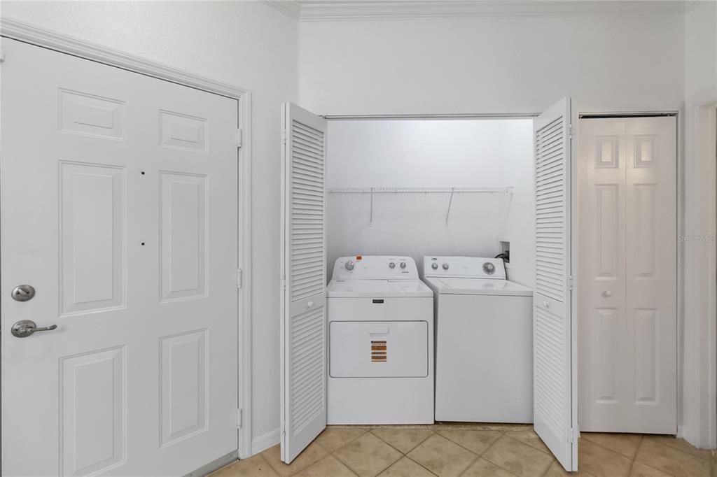 3599 Conroy Road, Unit 915 Orlando, FL 32839 - Photo 22 of 29 a utility room with dryer and washer